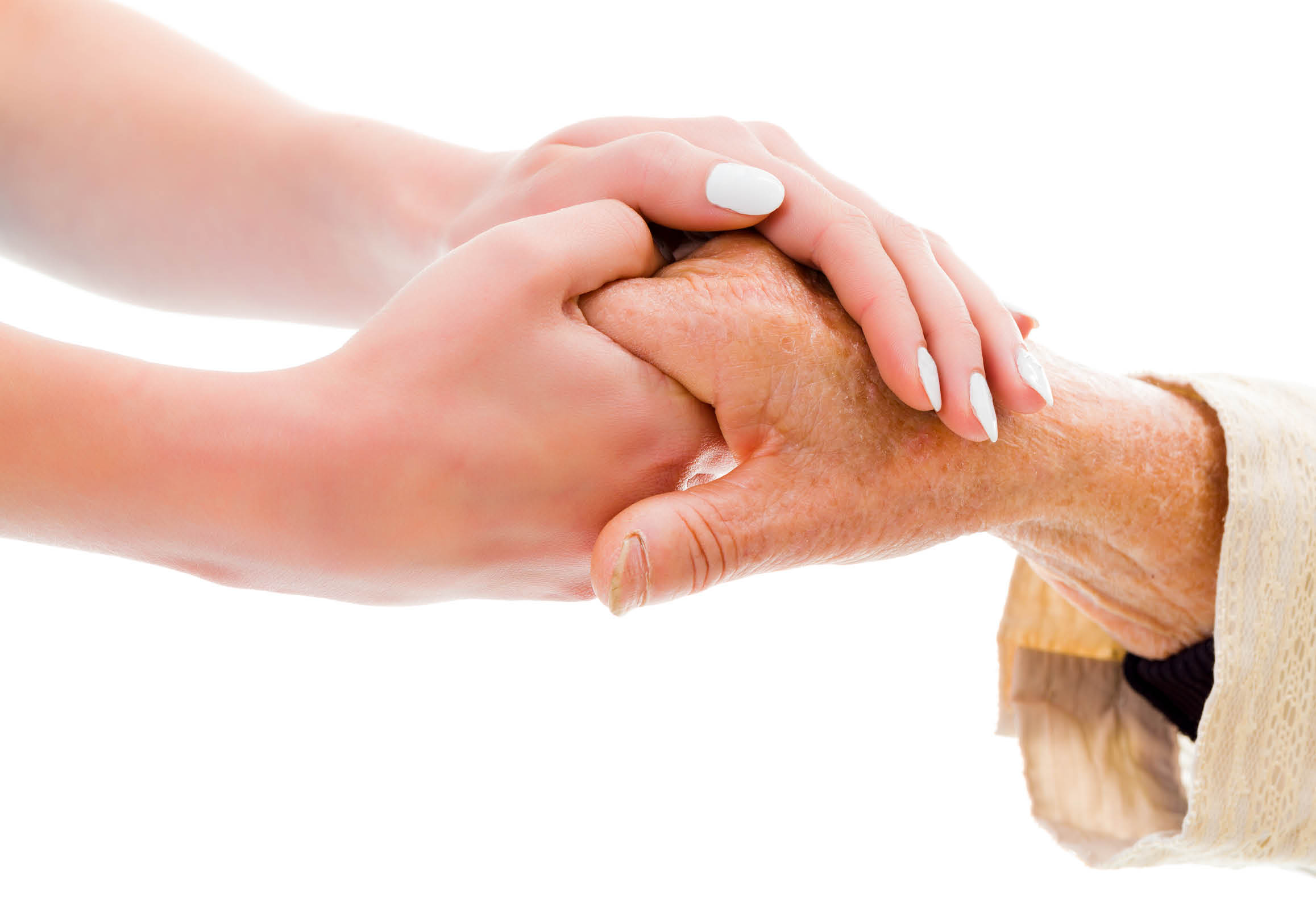 Yngre person håller handen på äldre person